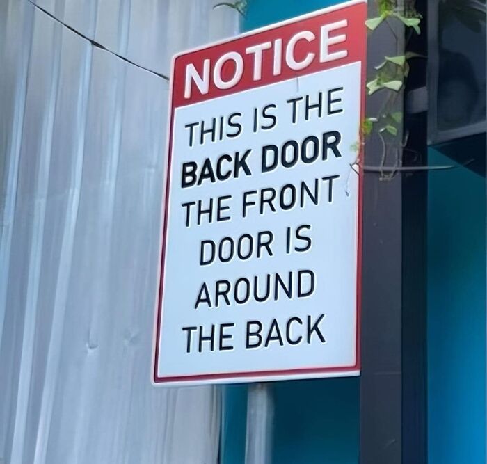 Notice sign humorously indicating back door locations, creating a confusing message. Notice sign humorously indicating back door locations, creating a confusing message.